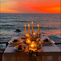 Cena romántica al atardecer frente al mar.